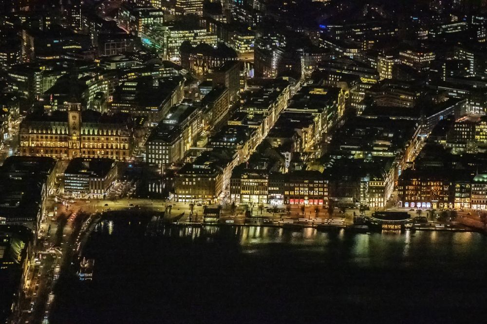 Aerial photograph at night Hamburg - Night lighting street guide of famous promenade and shopping street Jungfernstieg on the banks of the Binnenalster in the district Neustadt in Hamburg, Germany