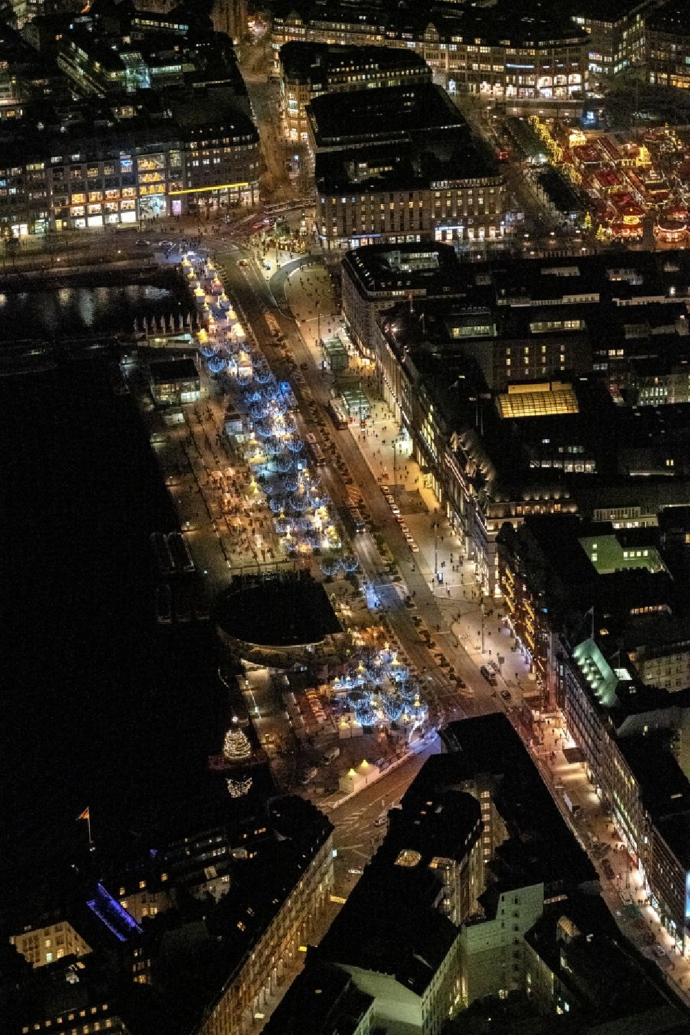 Aerial image at night Hamburg - Night lighting street guide of famous promenade and shopping street Jungfernstieg on the banks of the Binnenalster in the district Neustadt in Hamburg, Germany