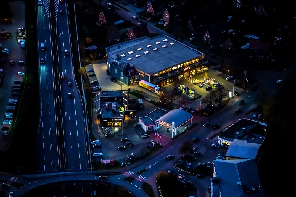 Stade at night from above - Night lighting gas station for sale of petrol and diesel fuels and mineral oil trade Kaisereichen in Stade in the state Lower Saxony, Germany