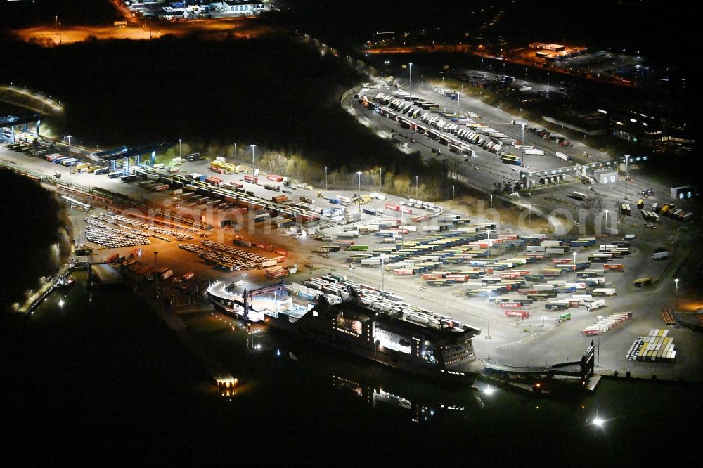 Travemünde at night from above - Night lighting building complex and distribution center on the site of Terminal Skandinavienkai in the district Ivendorf in Travemuende in the state Schleswig-Holstein, Germany