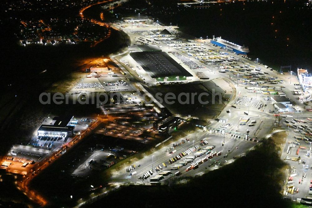 Aerial photograph at night Travemünde - Night lighting building complex and distribution center on the site of Terminal Skandinavienkai in the district Ivendorf in Travemuende in the state Schleswig-Holstein, Germany