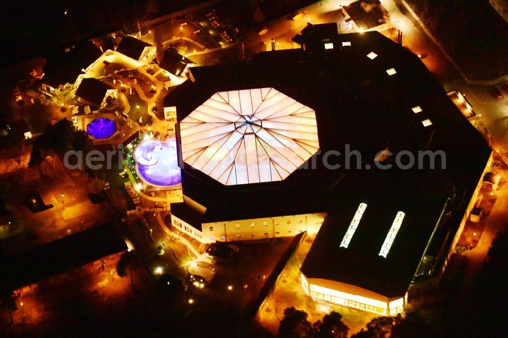 Aerial image at night Ludwigsfelde - Night lighting Spa and swimming pools at the swimming pool of the leisure facility in Ludwigsfelde in the state Brandenburg, Germany