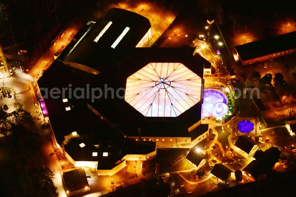 Aerial photograph at night Ludwigsfelde - Night lighting Spa and swimming pools at the swimming pool of the leisure facility in Ludwigsfelde in the state Brandenburg, Germany