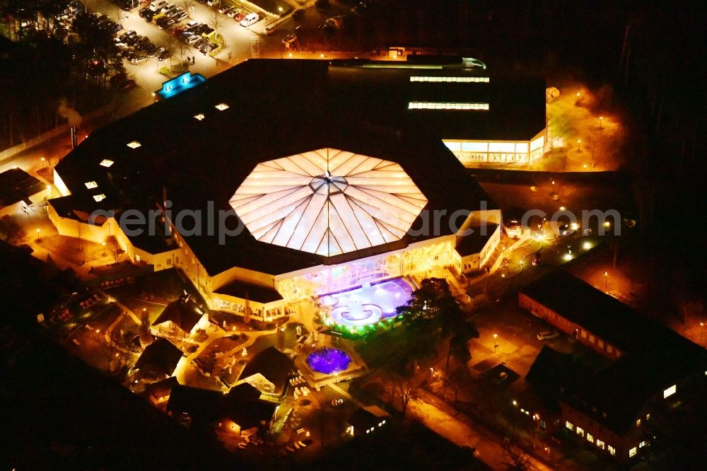Aerial image at night Ludwigsfelde - Night lighting Spa and swimming pools at the swimming pool of the leisure facility in Ludwigsfelde in the state Brandenburg, Germany