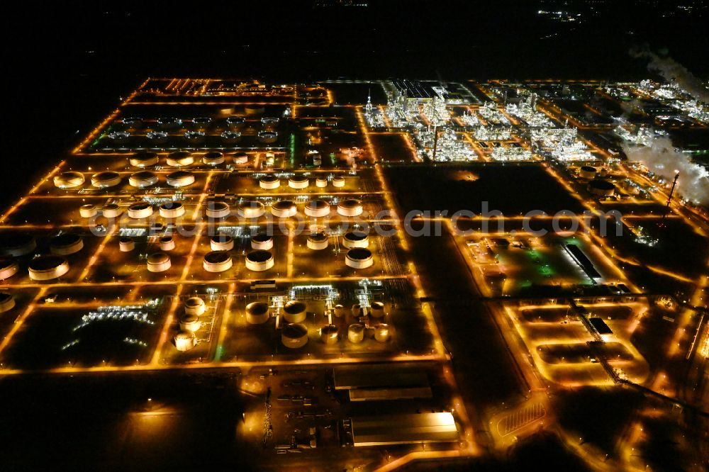 Aerial image at night Leuna - Night lighting tOTAL refinery in central Germany in Leuna in the federal state of Saxony-Anhalt. The TOTAL refinery chemical site Leuna is one of the most modern refineries in Europe
