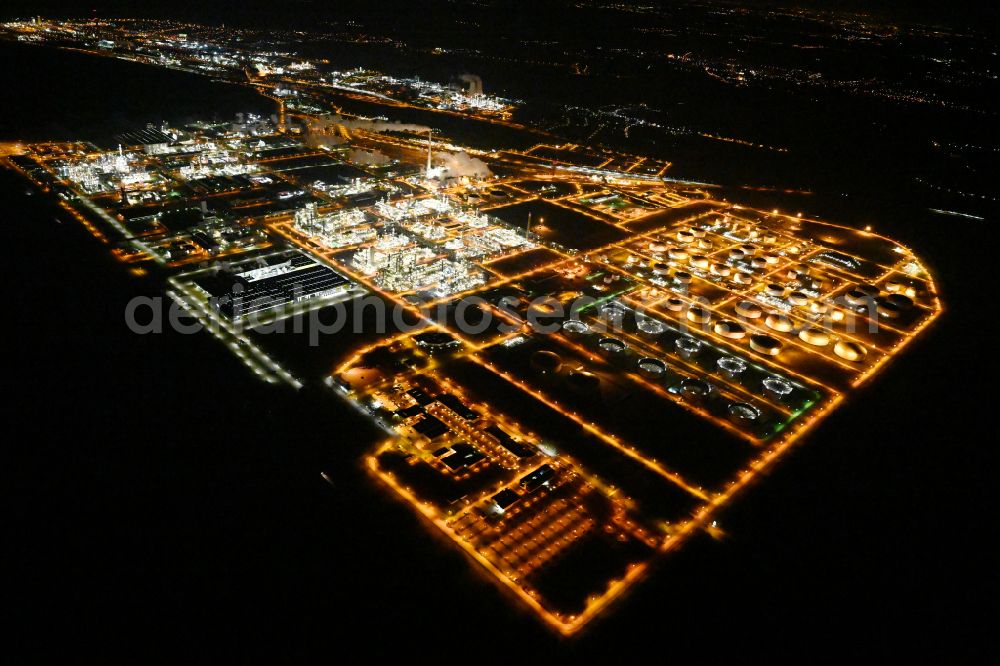 Leuna at night from above - Night lighting tOTAL refinery in central Germany in Leuna in the federal state of Saxony-Anhalt. The TOTAL refinery chemical site Leuna is one of the most modern refineries in Europe