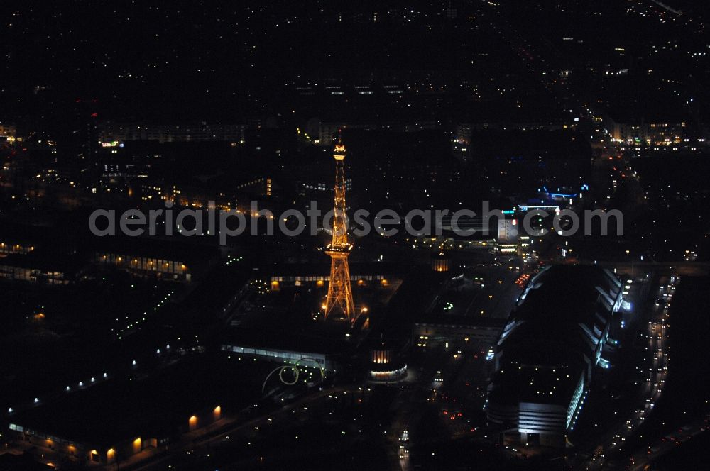 Berlin at night from above - Night lighting Tourist attraction and sightseeing Funkturm on Messegelaende in the district Charlottenburg in Berlin, Germany