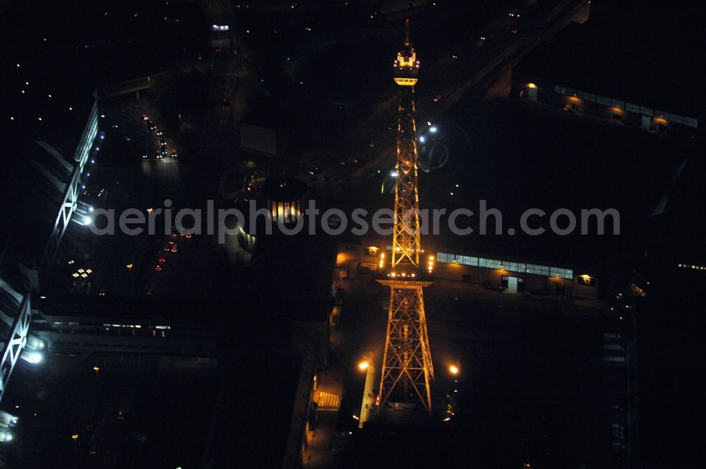 Berlin at night from the bird perspective: Night lighting Tourist attraction and sightseeing Funkturm on Messegelaende in the district Charlottenburg in Berlin, Germany