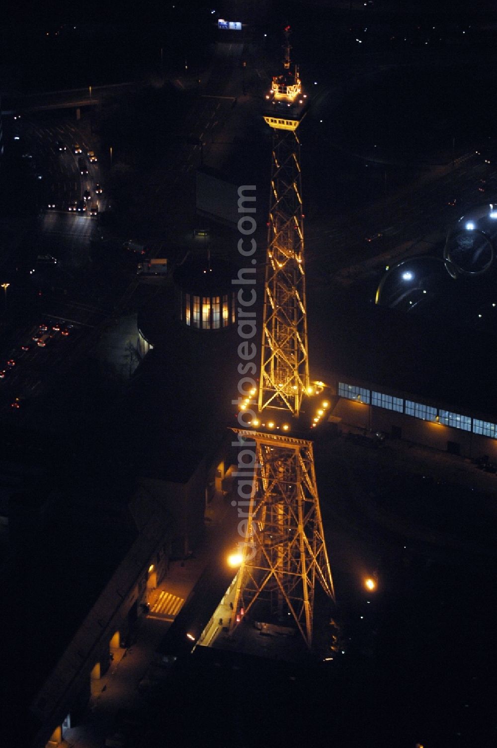 Aerial photograph at night Berlin - Night lighting Tourist attraction and sightseeing Funkturm on Messegelaende in the district Charlottenburg in Berlin, Germany