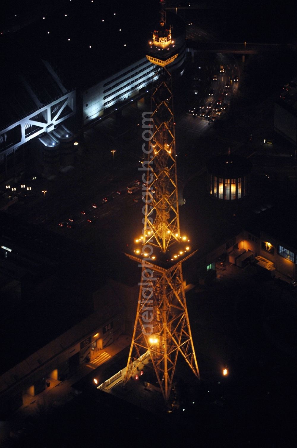 Berlin at night from above - Night lighting Tourist attraction and sightseeing Funkturm on Messegelaende in the district Charlottenburg in Berlin, Germany