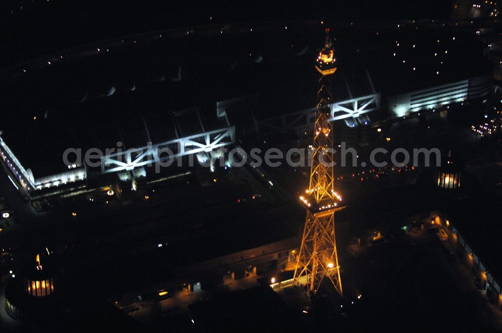 Berlin at night from the bird perspective: Night lighting Tourist attraction and sightseeing Funkturm on Messegelaende in the district Charlottenburg in Berlin, Germany