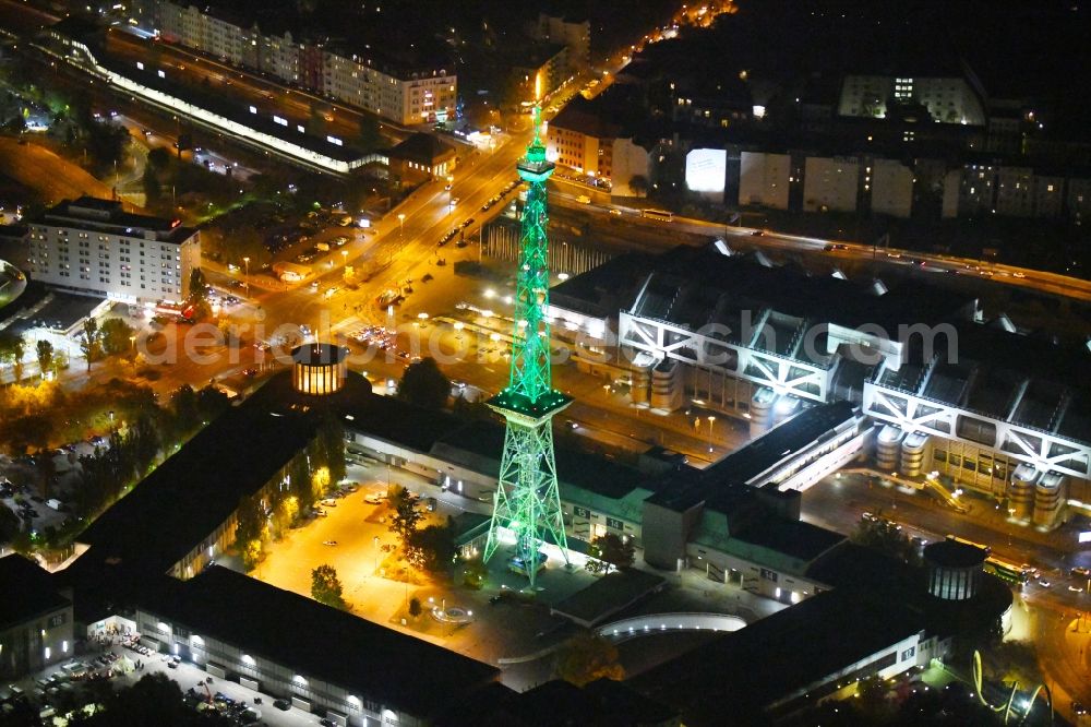 Aerial image at night Berlin - Night green lighting Tourist attraction and sightseeing Funkturm on Messegelaende in the district Charlottenburg in Berlin, Germany