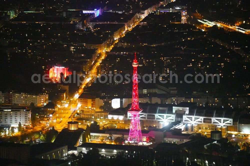 Berlin at night from above - Night purple lighting Tourist attraction and sightseeing Funkturm on Messegelaende in the district Charlottenburg in Berlin, Germany