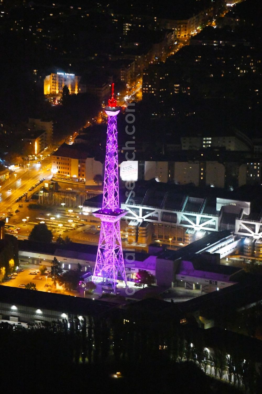 Aerial photograph at night Berlin - Night purple lighting Tourist attraction and sightseeing Funkturm on Messegelaende in the district Charlottenburg in Berlin, Germany