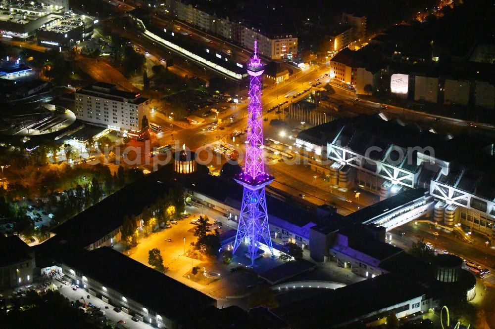 Aerial image at night Berlin - Night purple lighting Tourist attraction and sightseeing Funkturm on Messegelaende in the district Charlottenburg in Berlin, Germany