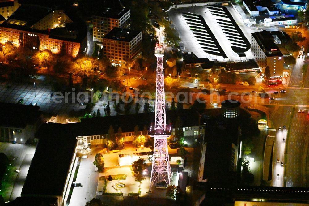 Berlin at night from the bird perspective: Night blue lighting Tourist attraction and sightseeing Funkturm on Messegelaende in the district Charlottenburg in Berlin, Germany