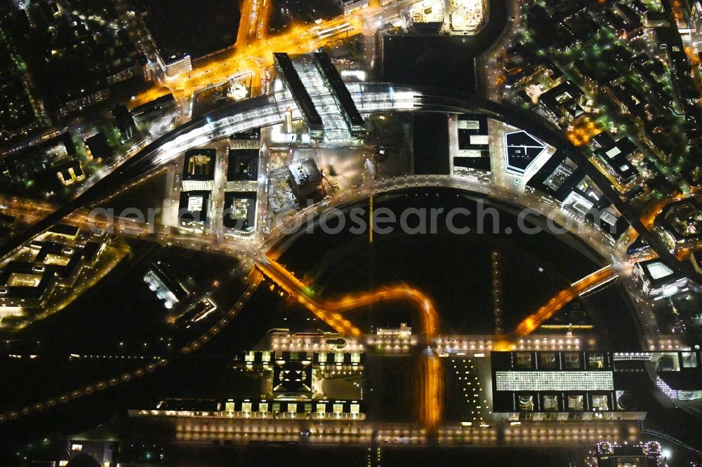 Berlin at night from above - Night lighting Riparian zones on the course of the river of Spree on Central Station in the district Mitte in Berlin, Germany