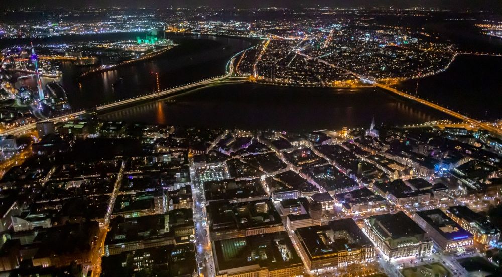 Düsseldorf at night from above - Night lighting curved loop of the riparian zones on the course of the river Rhine in Duesseldorf in the state North Rhine-Westphalia, Germany