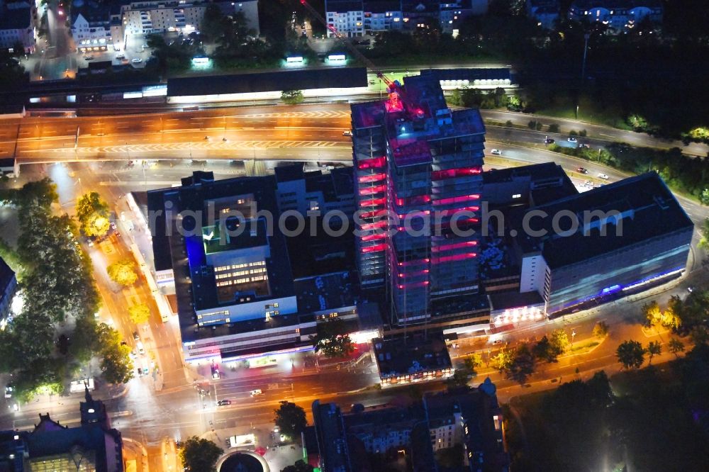 Berlin at night from above - Night lighting highrise building of the Steglitzer Kreisel - UeBERLIN Wohntower complex on Schlossstrasse in the district of Steglitz in Berlin