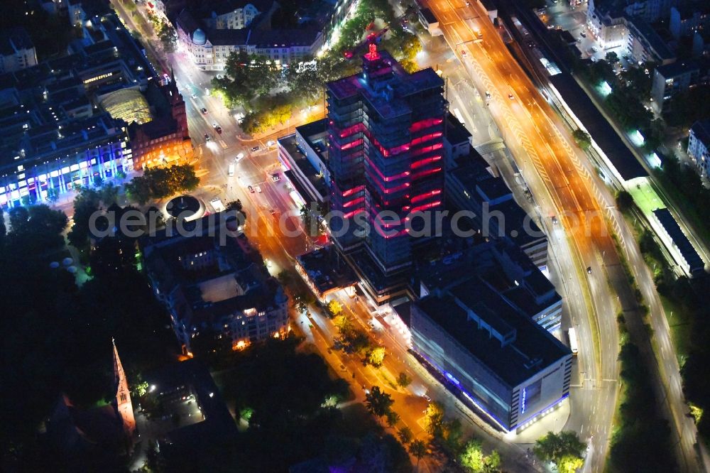 Aerial photograph at night Berlin - Night lighting highrise building of the Steglitzer Kreisel - UeBERLIN Wohntower complex on Schlossstrasse in the district of Steglitz in Berlin