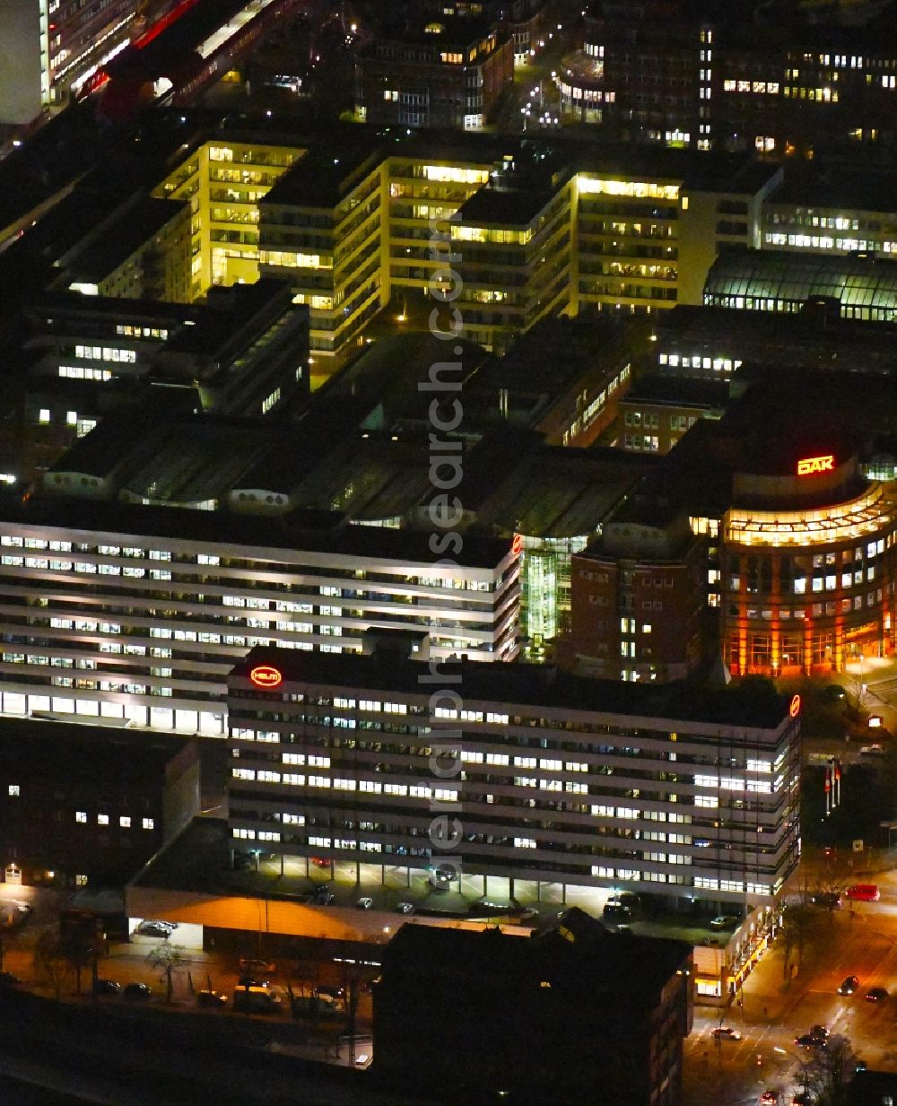 Hamburg at night from the bird perspective: Night lighting administration building of the company of HELM AG on Nordkanalstrasse in the district Hammerbrook in Hamburg, Germany