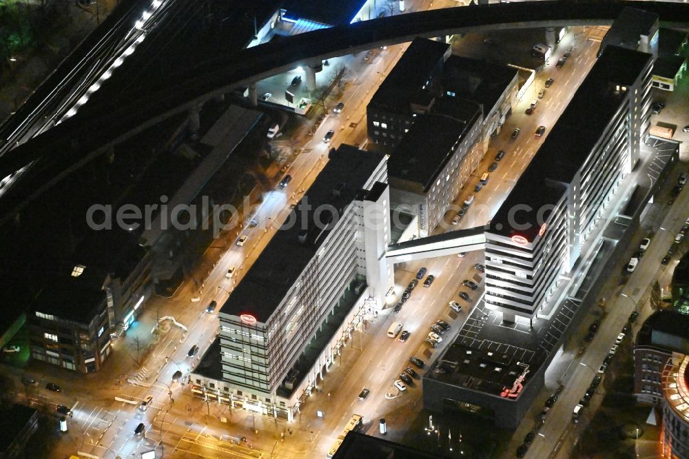 Hamburg at night from the bird perspective: Night lighting administration building of the company of HELM AG on Nordkanalstrasse in the district Hammerbrook in Hamburg, Germany
