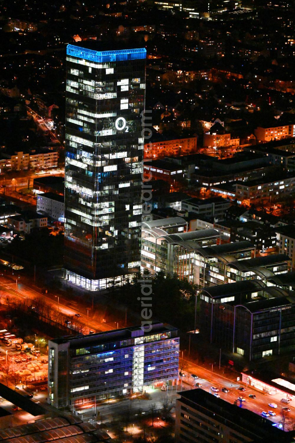 München at night from the bird perspective: Night lighting uptown high-rise building - headquarters of Telefonica Germany (O2) and Astellas Pharma GmbH on Georg-Brauchle-Ring in the Moosach district of Munich in the state of Bavaria