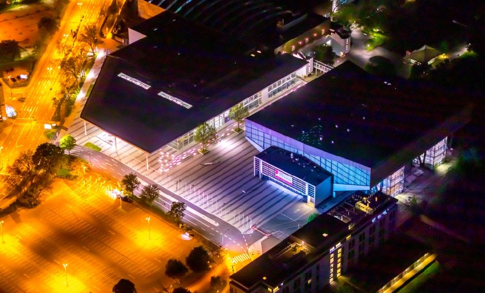 Aerial image at night Essen - Night lighting building of the indoor arena Grugahalle on place Messeplatz in the district Ruettenscheid in Essen at Ruhrgebiet in the state North Rhine-Westphalia, Germany