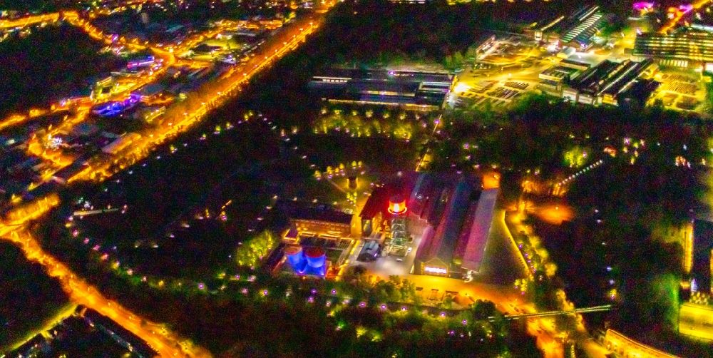 Aerial image at night Bochum - Night lighting building of the event hall of the Jahrhunderthalle Bochum in Bochum at Ruhrgebiet in the state of North Rhine-Westphalia. The Jahrhunderthalle is the center of the new Bochum Westpark, with which this inner-city, former industrial area for housing, culture, recreation and trade is developed