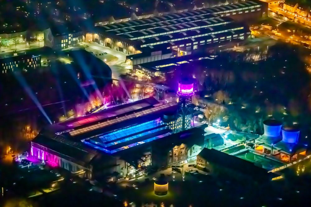 Aerial image at night Bochum - Night lighting building of the event hall of the Jahrhunderthalle Bochum to the event zur 1Live Krone in Bochum in the state of North Rhine-Westphalia. The Jahrhunderthalle is the center of the new Bochum Westpark, with which this inner-city, former industrial area for housing, culture, recreation and trade is developed
