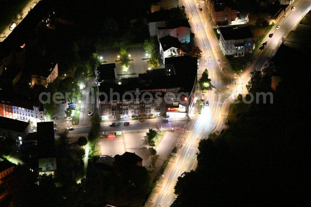Aerial image at night Eberswalde - Night lighting banking administration building of the financial services company Sparkasse Barnim - Beratungs-Center on street Michaelisstrasse in Eberswalde in the state Brandenburg, Germany