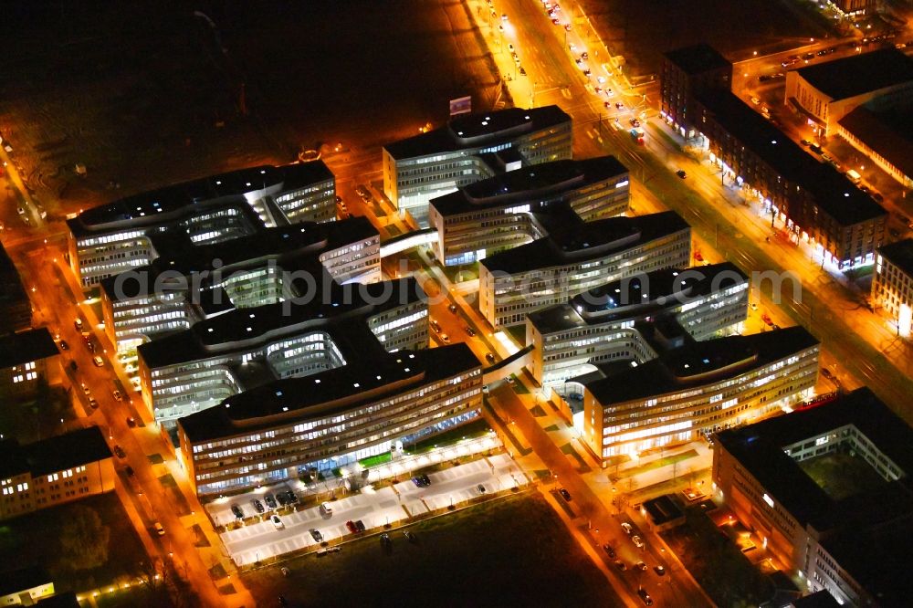 Berlin at night from the bird perspective: Night lighting office and administration buildings of the insurance company Allianz Campus Berlin in the district Adlershof in Berlin, Germany
