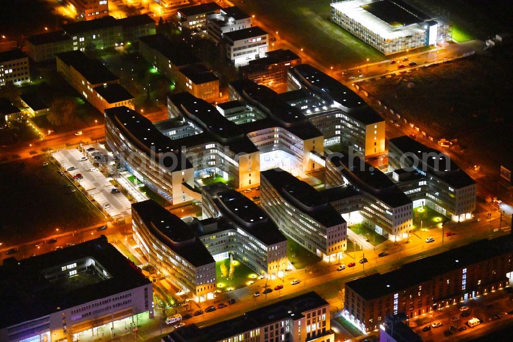 Berlin at night from above - Night lighting office and administration buildings of the insurance company Allianz Campus Berlin in the district Adlershof in Berlin, Germany