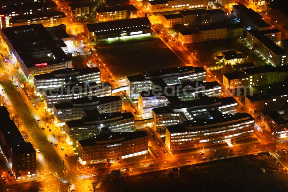 Aerial photograph at night Berlin - Night lighting office and administration buildings of the insurance company Allianz Campus Berlin in the district Adlershof in Berlin, Germany