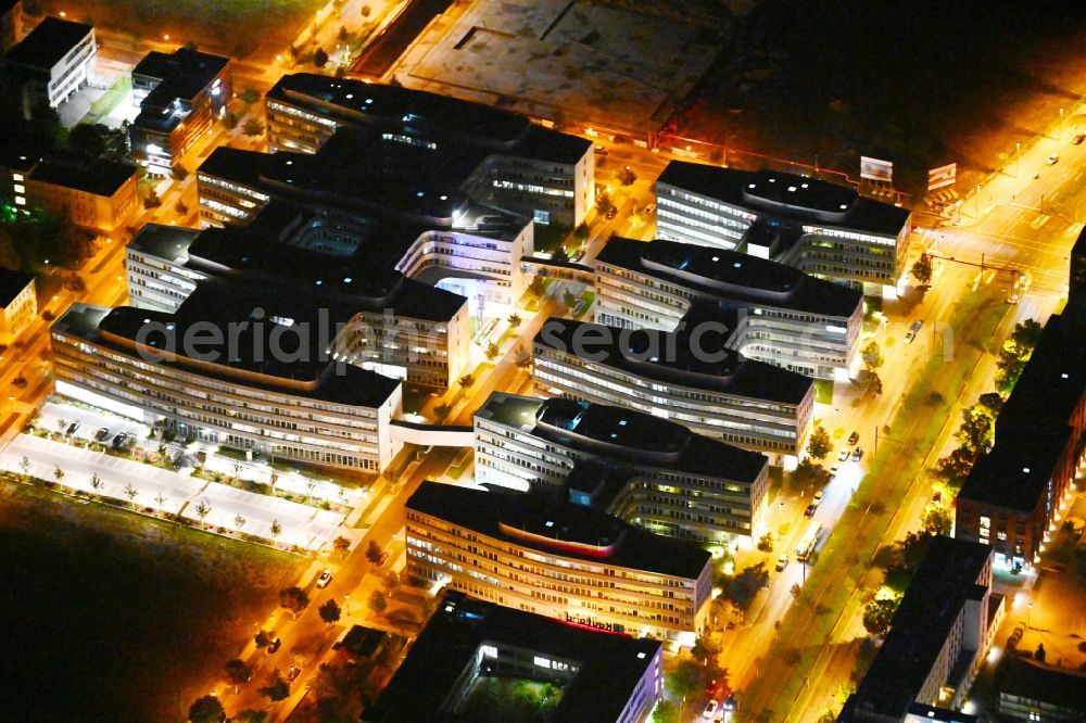 Berlin at night from the bird perspective: Night lighting office and administration buildings of the insurance company Allianz Campus Berlin in the district Adlershof in Berlin, Germany