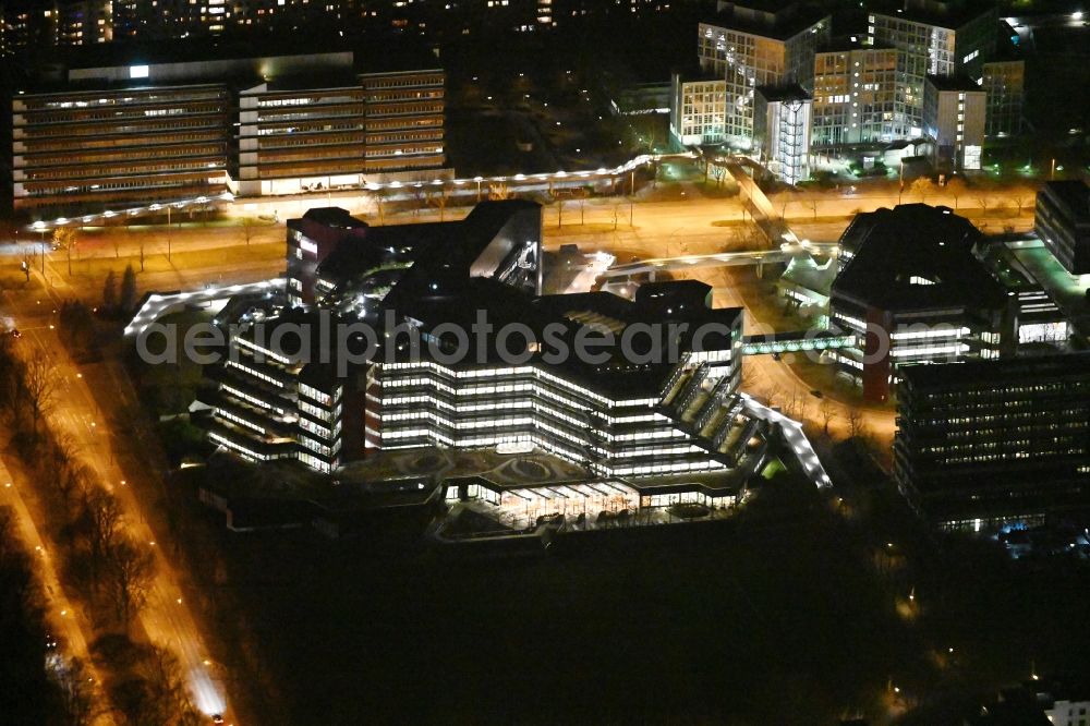 Hamburg at night from above - Night lighting office and administration buildings of the insurance company ERGO Direkt AG on Karl-Martell-Strasse in the district Winterhude in Hamburg, Germany