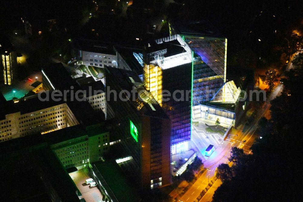 Aerial image at night Münster - Night lighting Office and administration buildings of the insurance company LVM Versicherung - Zentrale on Kolde-Ring in the district Aaseestadt in Muenster in the state North Rhine-Westphalia, Germany