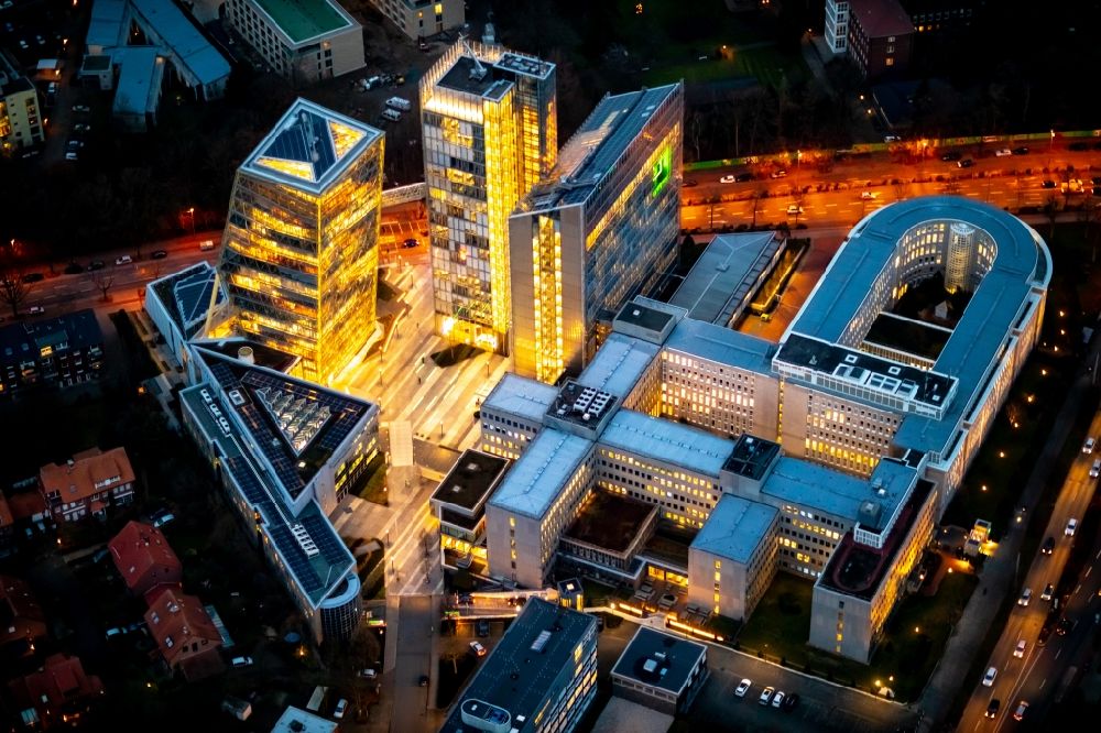 Aerial image at night Münster - Night lighting Office and administration buildings of the insurance company LVM Versicherung - Zentrale on Kolde-Ring in the district Aaseestadt in Muenster in the state North Rhine-Westphalia, Germany