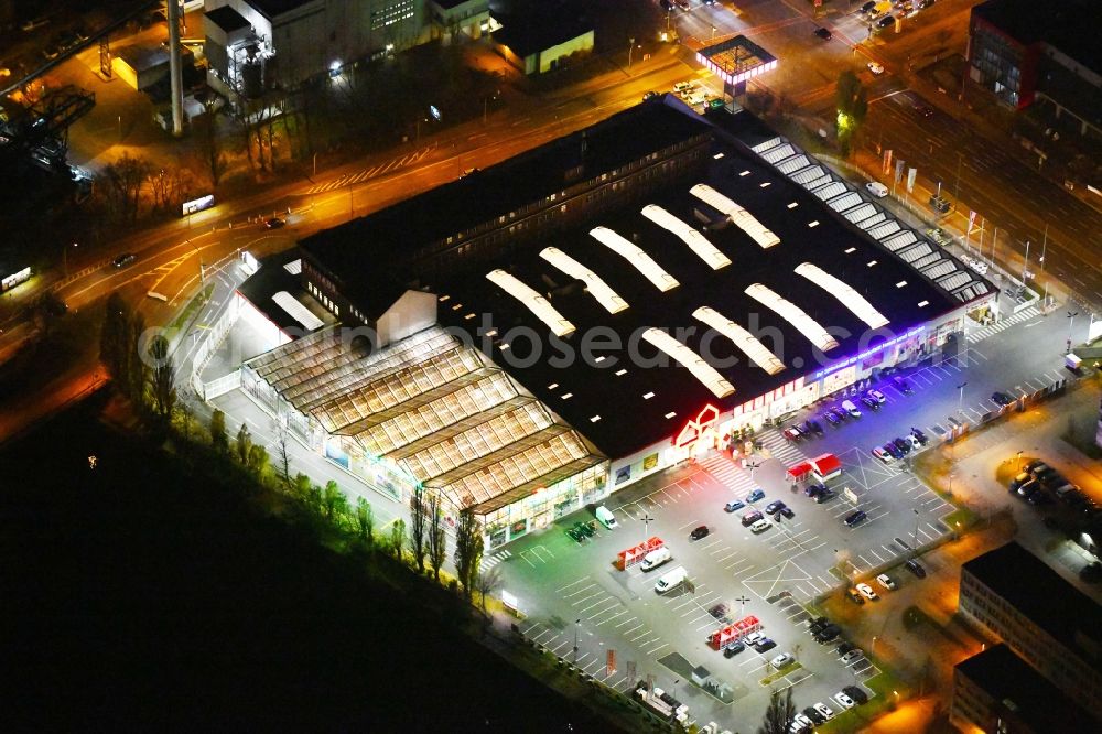 Berlin at night from above - Night lighting Building of the construction market Bauhaus Schnellerstrasse - federal road B96a - Karlshorster Strasse in the district Treptow in Berlin