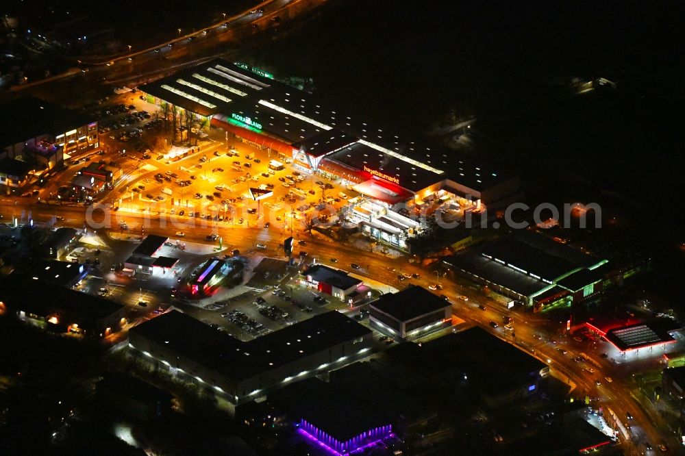 Aerial image at night Lübeck - Night view building of the construction market of hagebaumarkt in Luebeck in the state Schleswig-Holstein