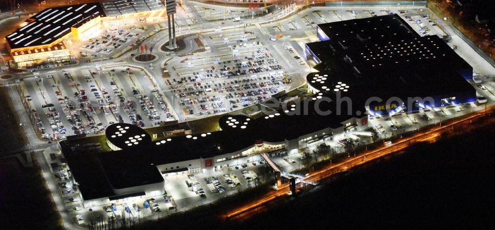 Aerial photograph at night Lübeck - Night view building the shopping mall LUV SHOPPING at IKEA furnishing house in Daenischburg, Luebeck in Schleswig-Holstein