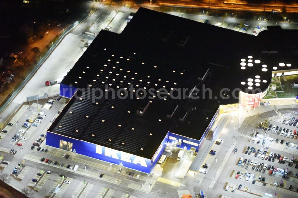 Lübeck at night from the bird perspective: Night view building the shopping mall LUV SHOPPING at IKEA furnishing house in Daenischburg, Luebeck in Schleswig-Holstein
