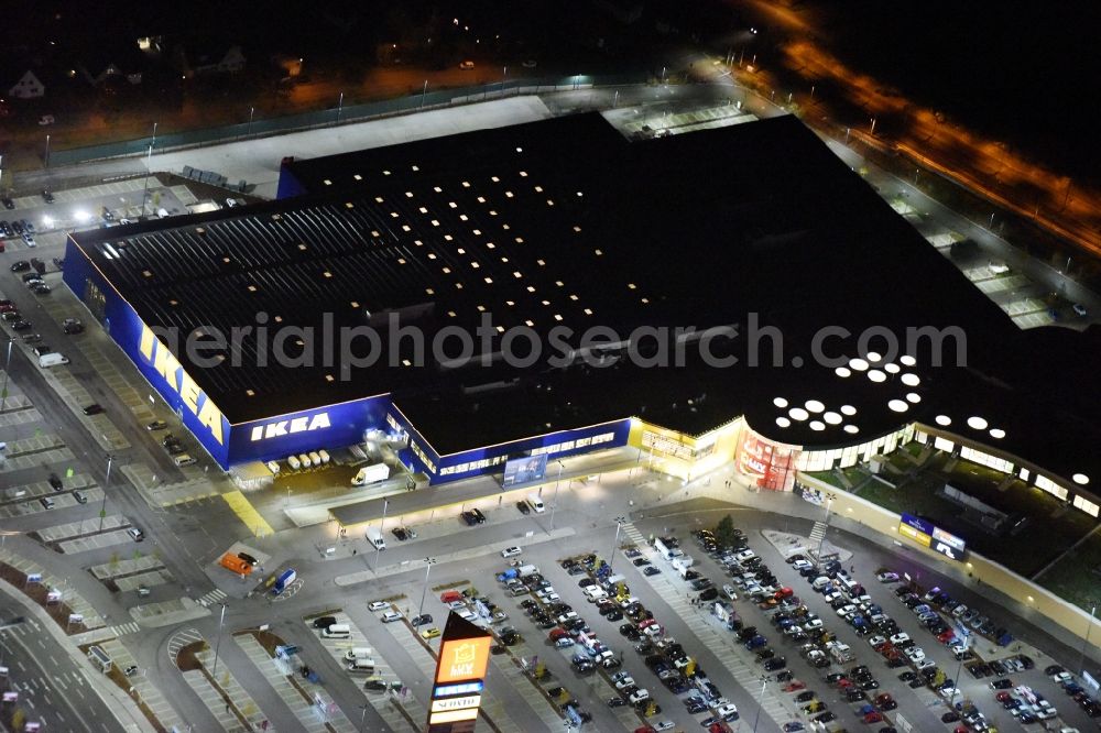 Aerial photograph at night Lübeck - Night view building the shopping mall LUV SHOPPING at IKEA furnishing house in Daenischburg, Luebeck in Schleswig-Holstein