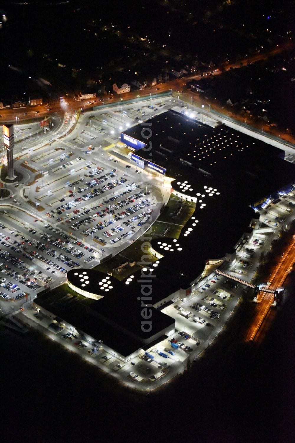 Aerial image at night Lübeck - Night view building the shopping mall LUV SHOPPING at IKEA furnishing house in Daenischburg, Luebeck in Schleswig-Holstein