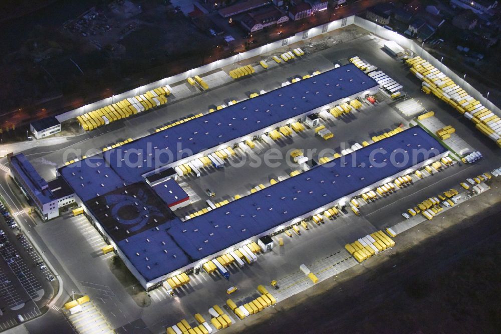 Rüdersdorf at night from above - Night lighting Night view building complex and grounds of DHL in the district Ruedersdorf in Ruedersdorf in the state Brandenburg