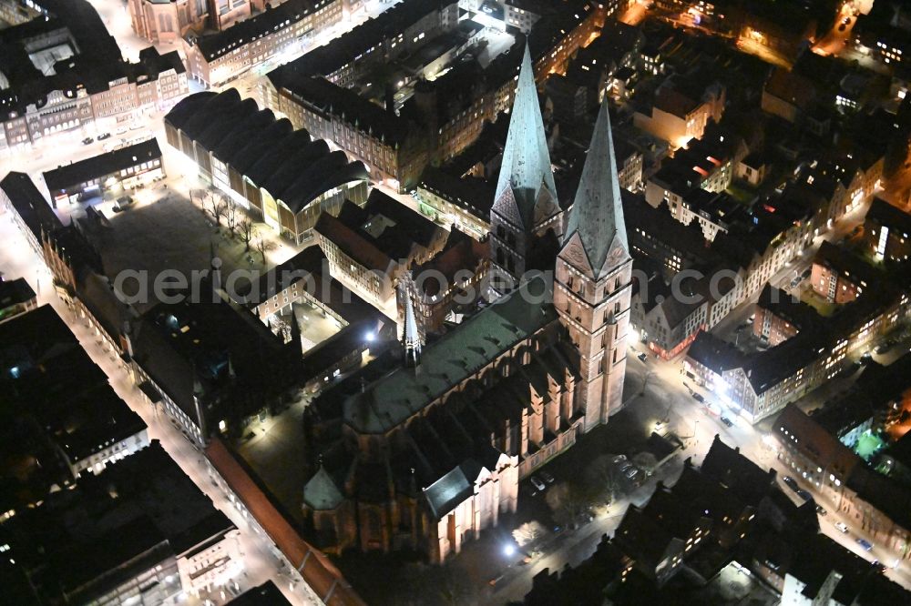 Aerial image at night Lübeck - Night view church building of the Marienkirche on Marienkirchhof Old Town- center of downtown in Luebeck in the state Schleswig-Holstein