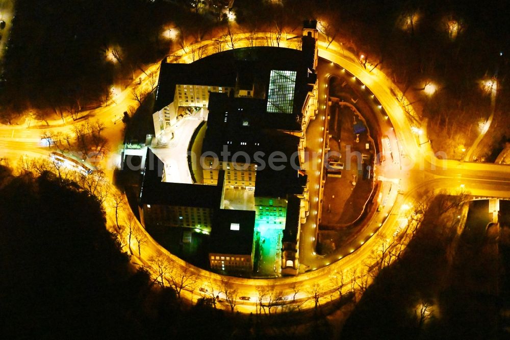 München at night from the bird perspective: Night view of palatial building Maximilianeum in the Haidhausen part of Munich in the state of Bavaria. The historic building is located on the Maximilian Bridge and includes the foundation Maximilianeum and has been seat of the Bavarian parliament
