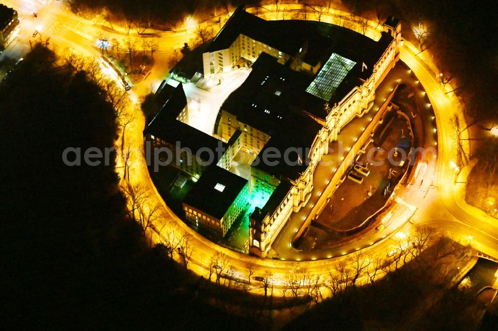 Aerial photograph at night München - Night view of palatial building Maximilianeum in the Haidhausen part of Munich in the state of Bavaria. The historic building is located on the Maximilian Bridge and includes the foundation Maximilianeum and has been seat of the Bavarian parliament