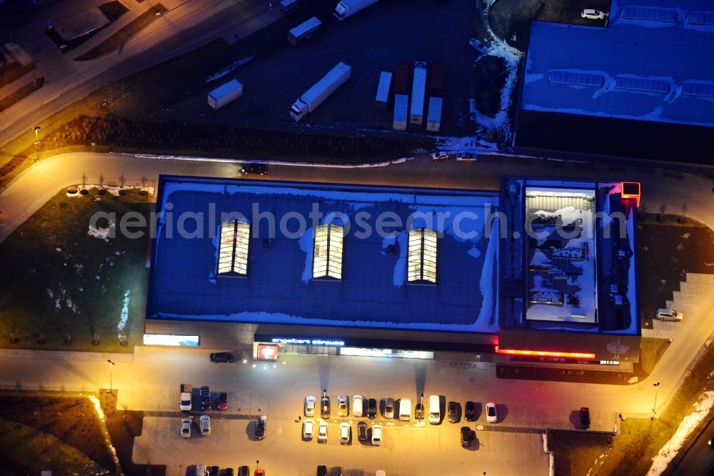 Bergkirchen at night from above - Night aerial of the new building of the clothing store Engelbert Strauss in Bergkirchen in Bavaria