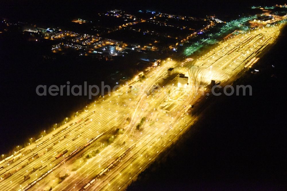 Aerial photograph at night Neuseddin - Night view marshalling yard and freight station of the Deutsche Bahn in Neuseddin in the state Brandenburg